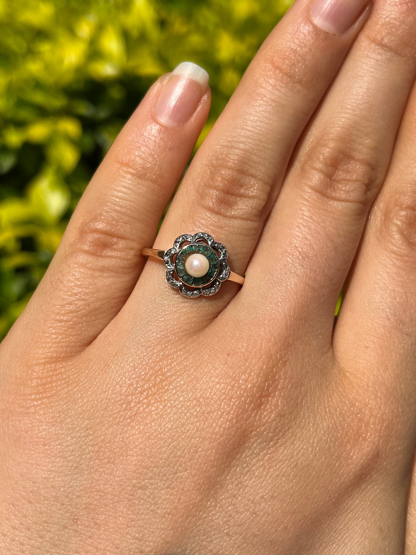 9K gold Edwardian pearl, emerald, and diamond flower ring.