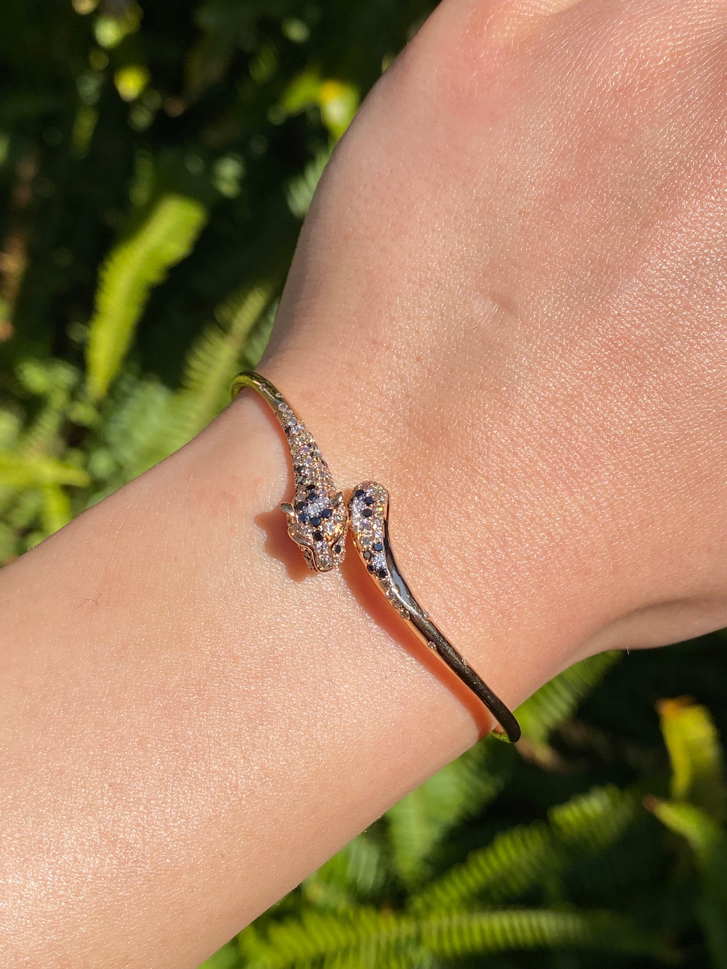 18K gold ruby and diamond leopard bangle.