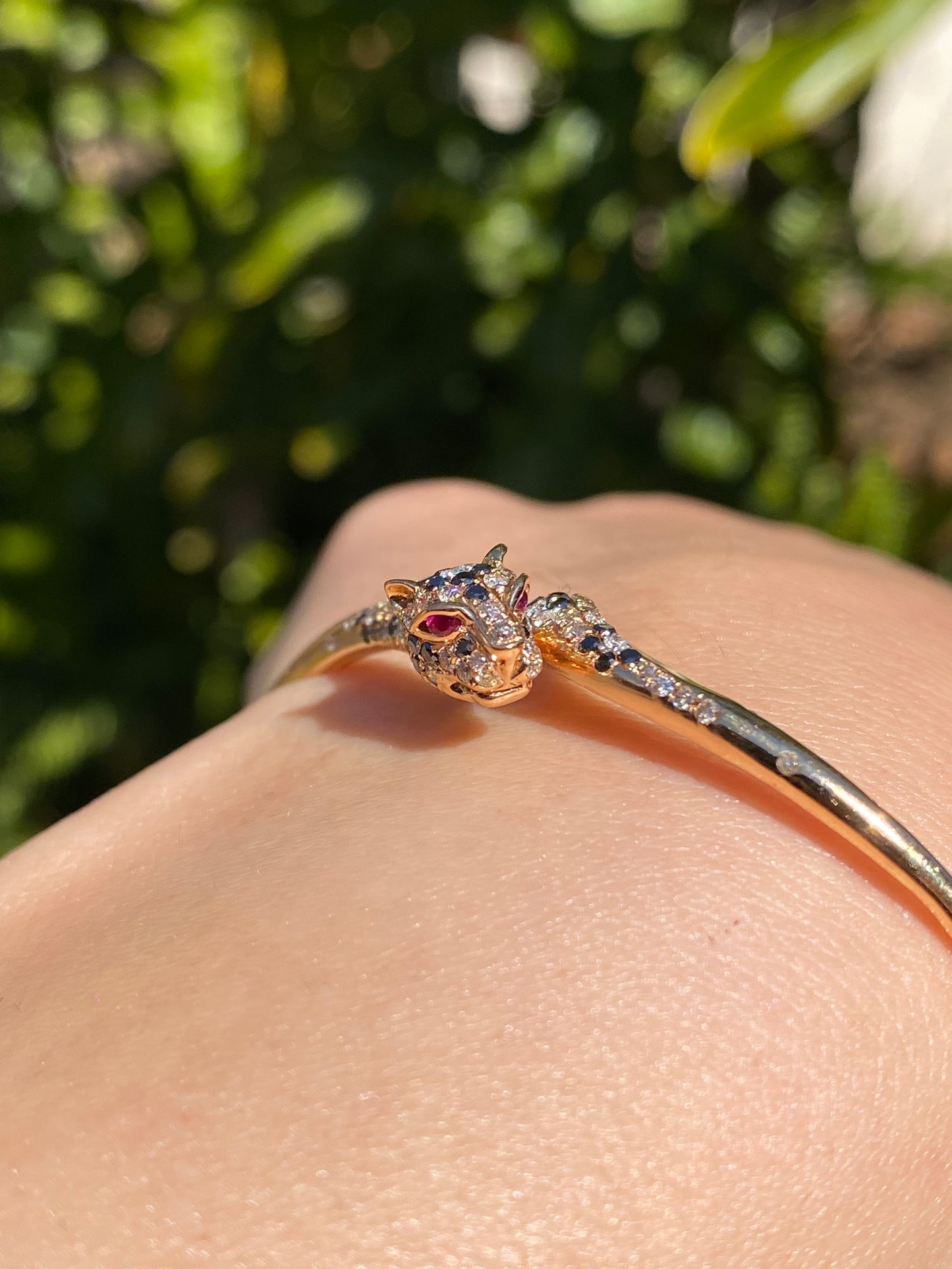 18K gold ruby and diamond leopard bangle.