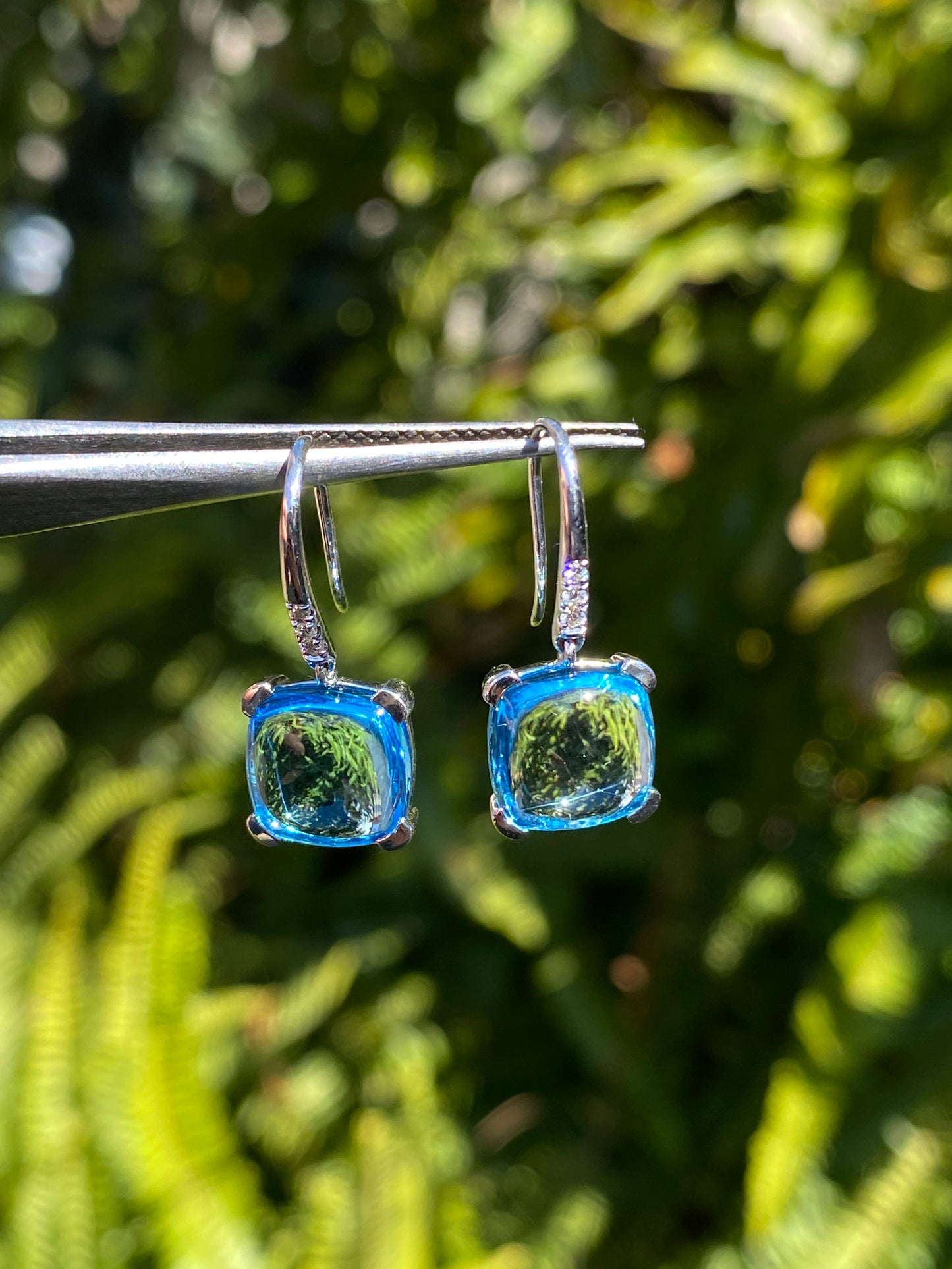 14K gold blue topaz and diamond drop earrings.