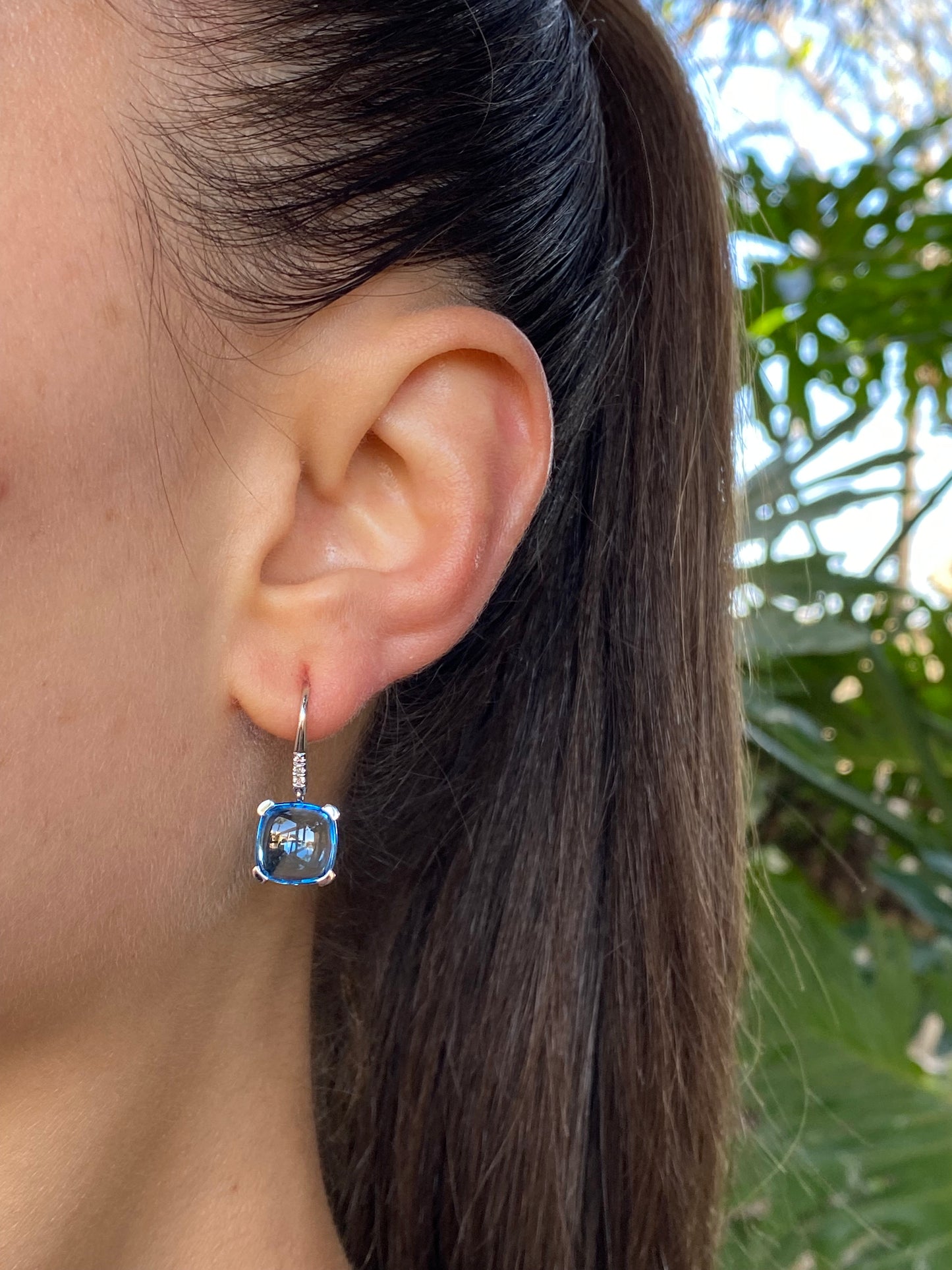 14K gold blue topaz and diamond drop earrings.