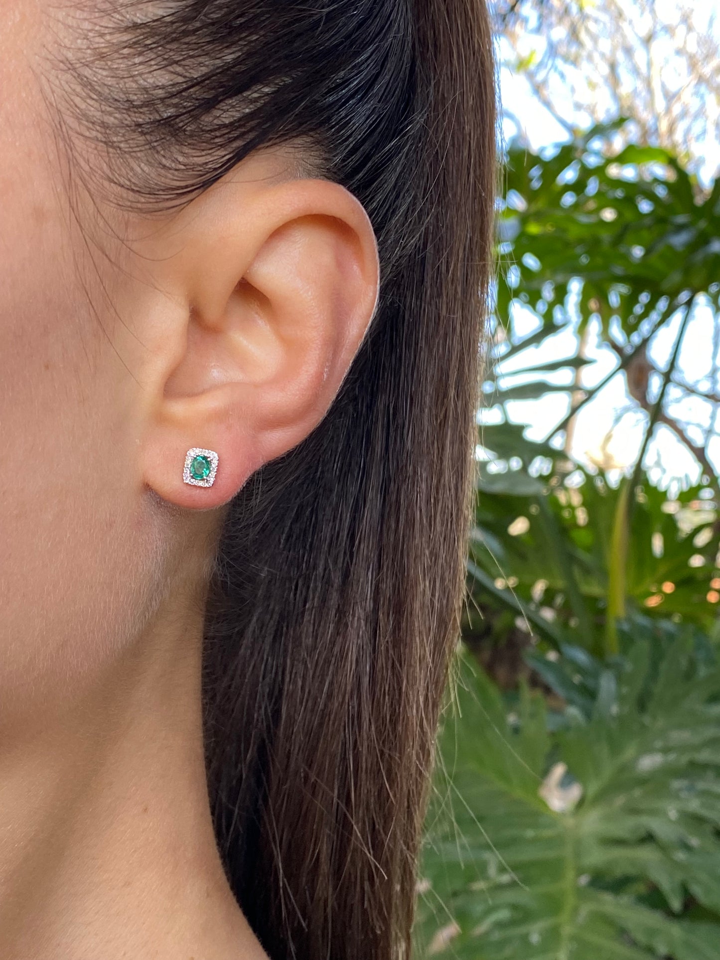 9K gold emerald and diamond earrings.