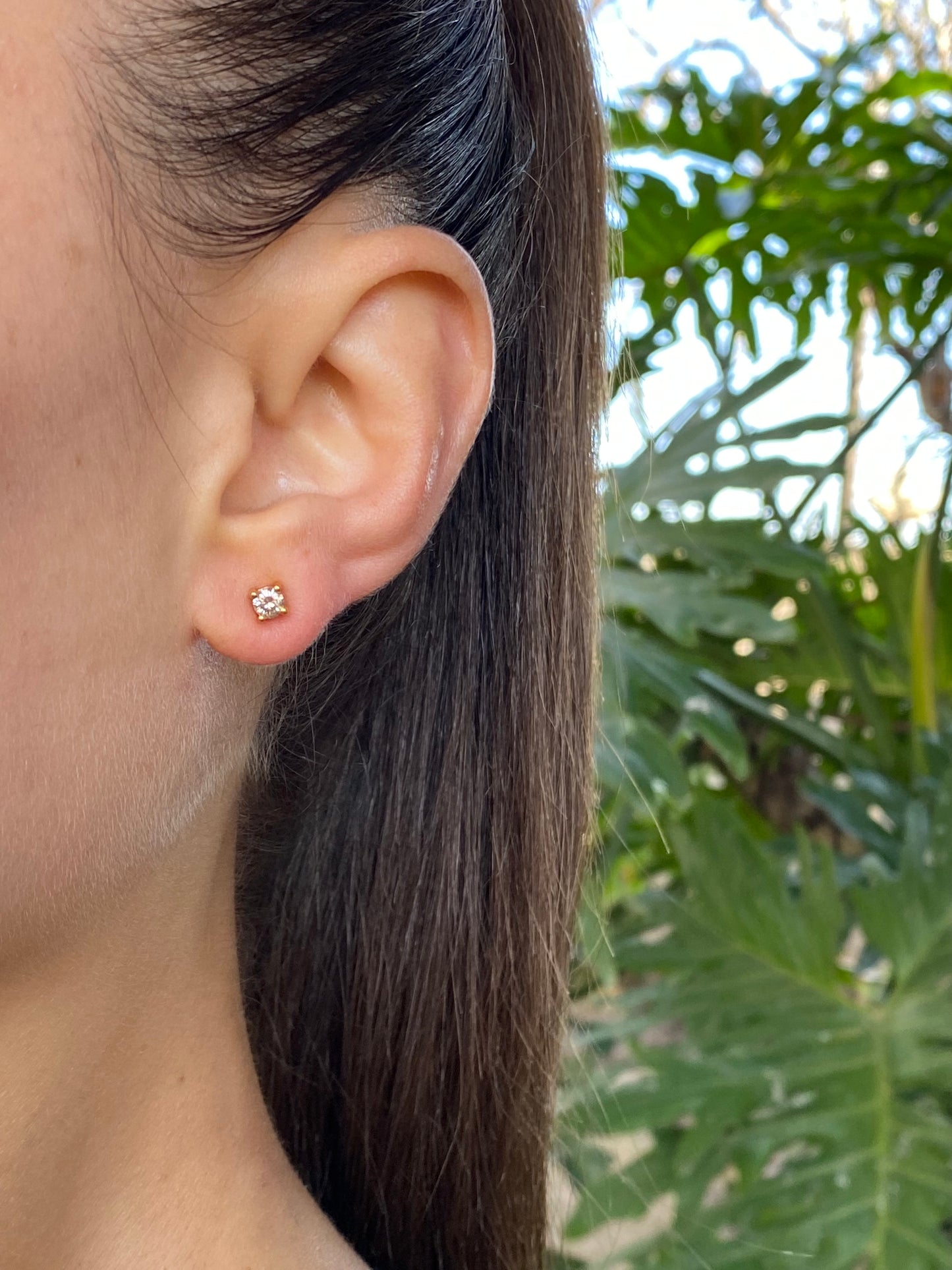 18K gold diamond stud earrings.