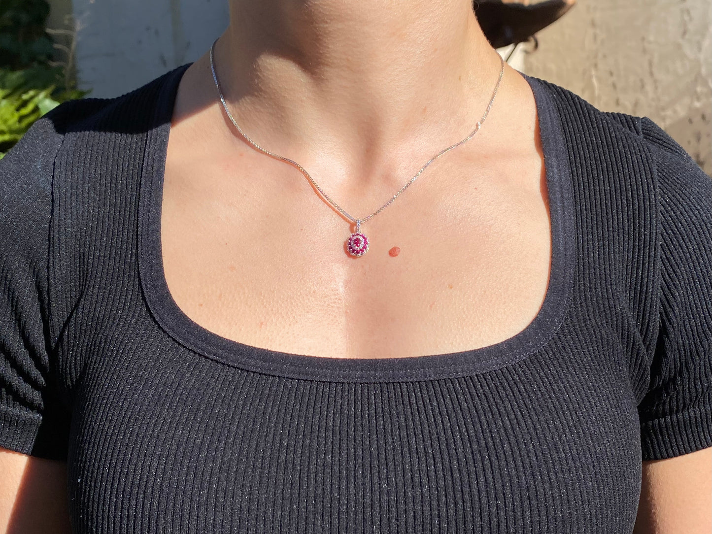 18K gold ruby and diamond pendant.