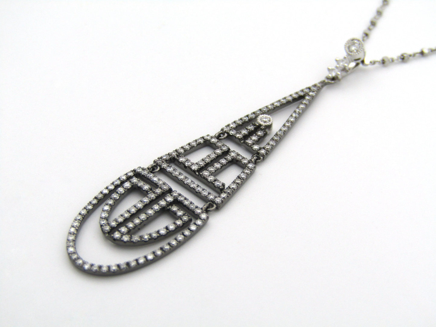 18K gold diamond Art Deco style geometric pendant.