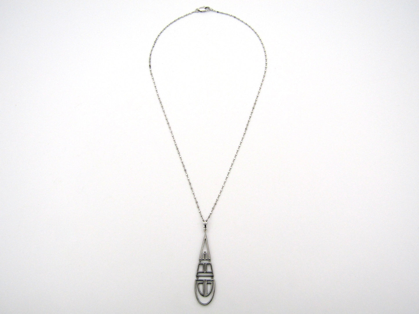 18K gold diamond Art Deco style geometric pendant.