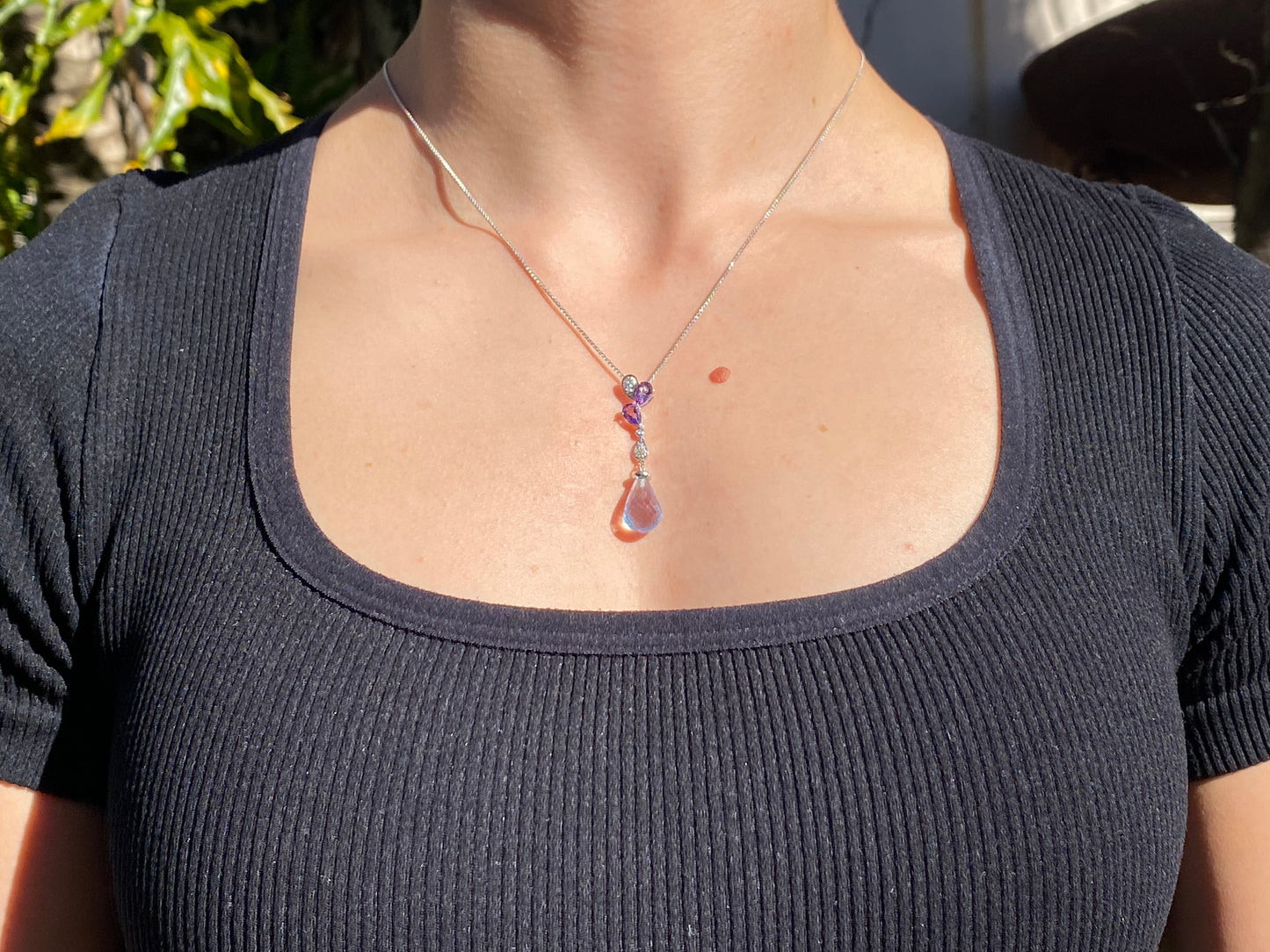 18K gold blue topaz, amethyst, and diamond pendant.