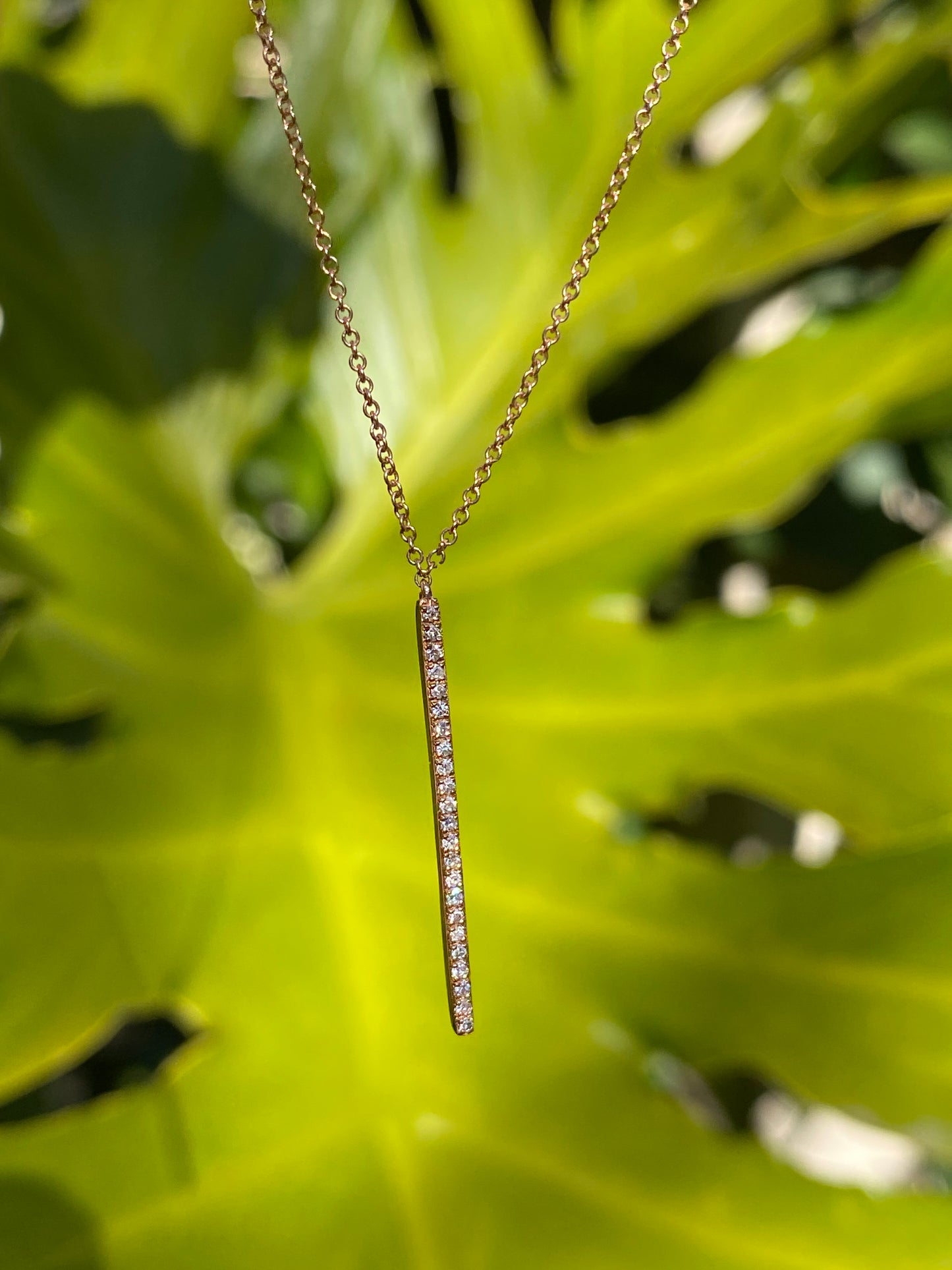 9K gold diamond bar necklace.