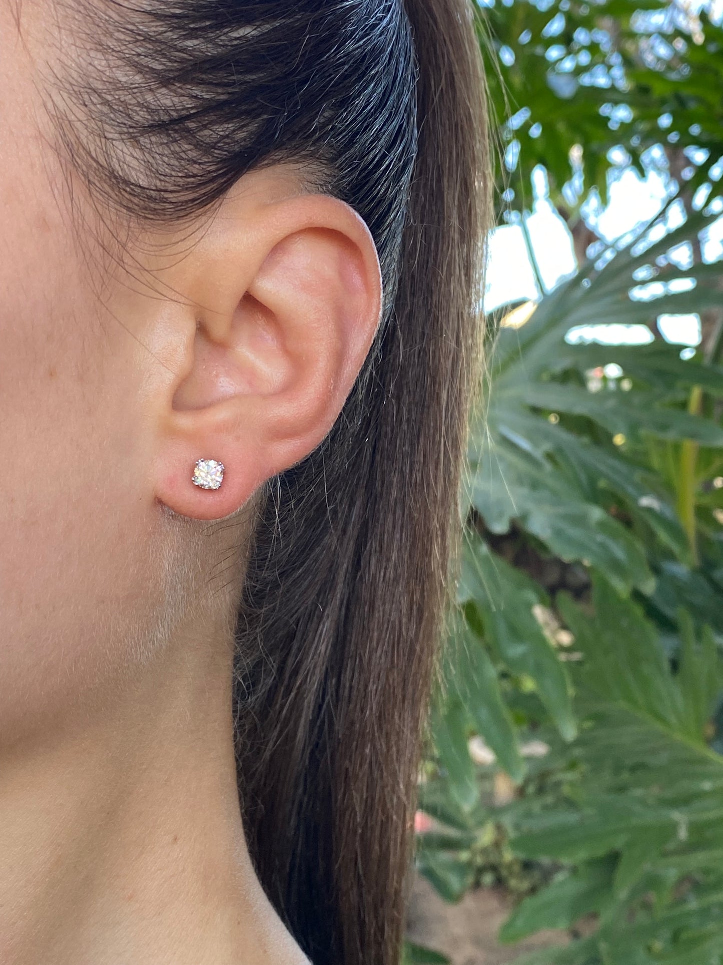 9K gold diamond studs.