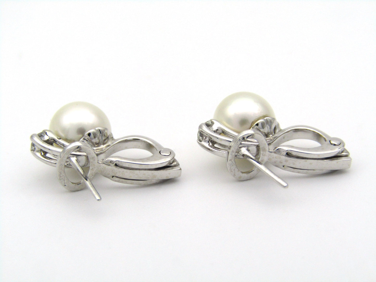 18K gold cultured pearl and diamond earrings.