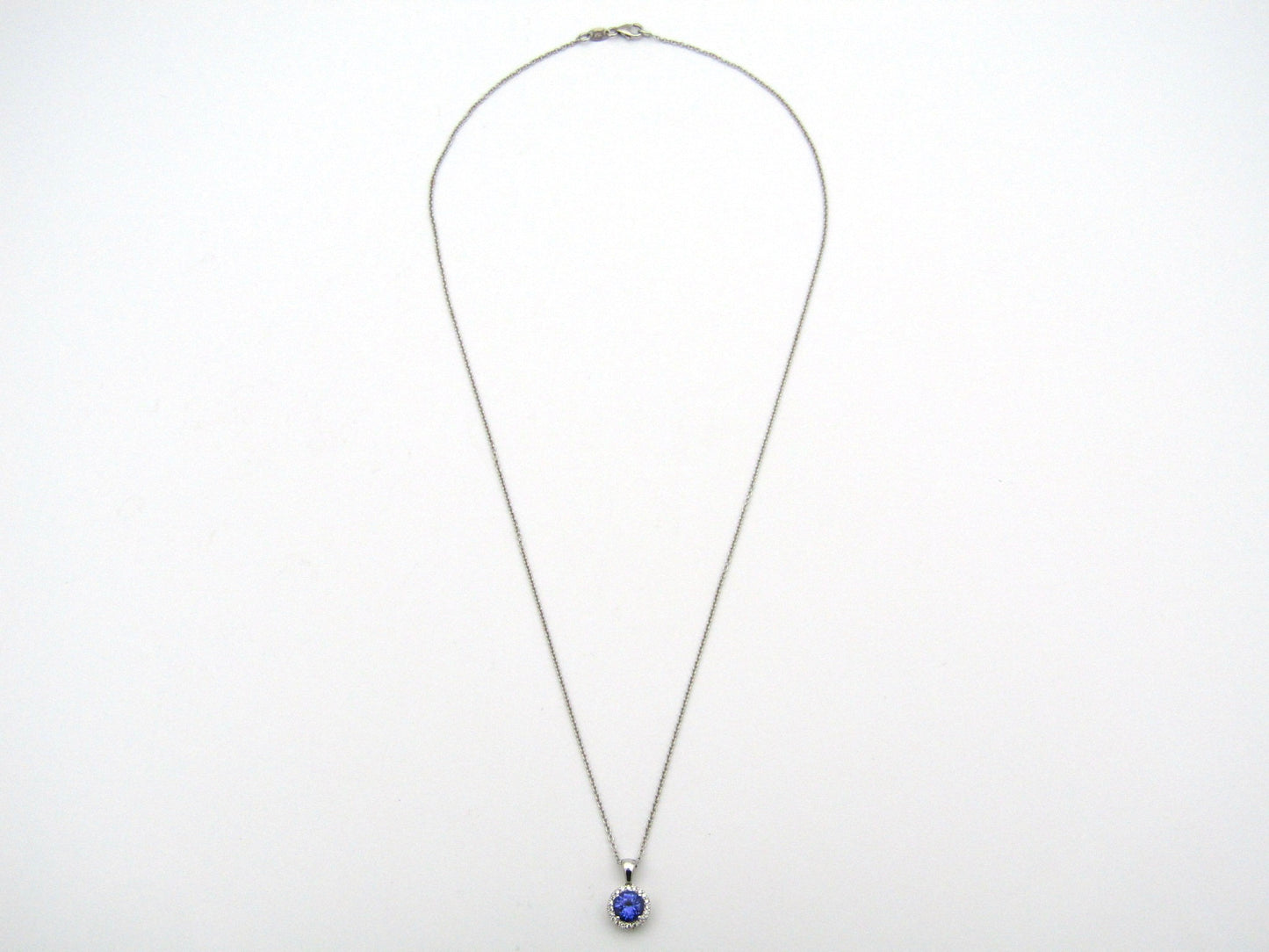 18K gold tanzanite and diamond pendant by Browns.