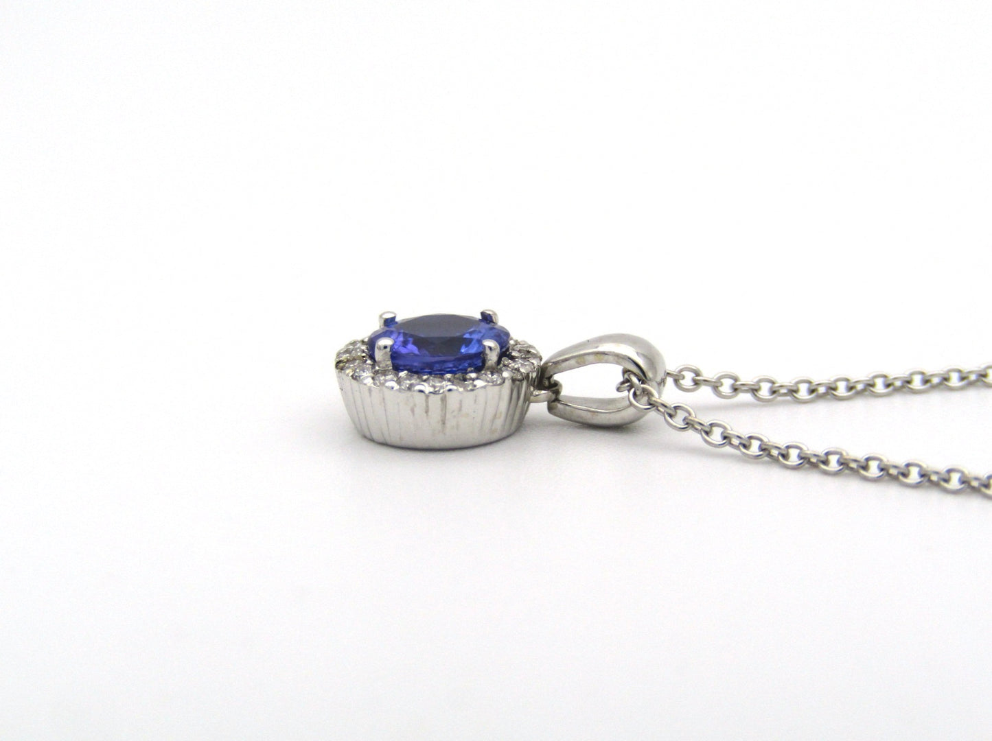 18K gold tanzanite and diamond pendant by Browns.