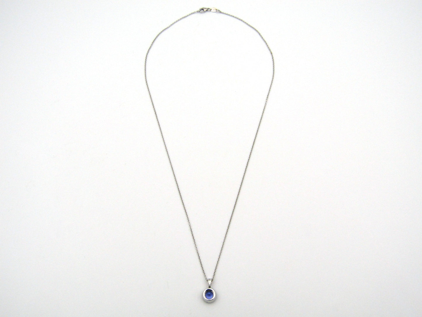 18K gold tanzanite and diamond pendant by Browns.