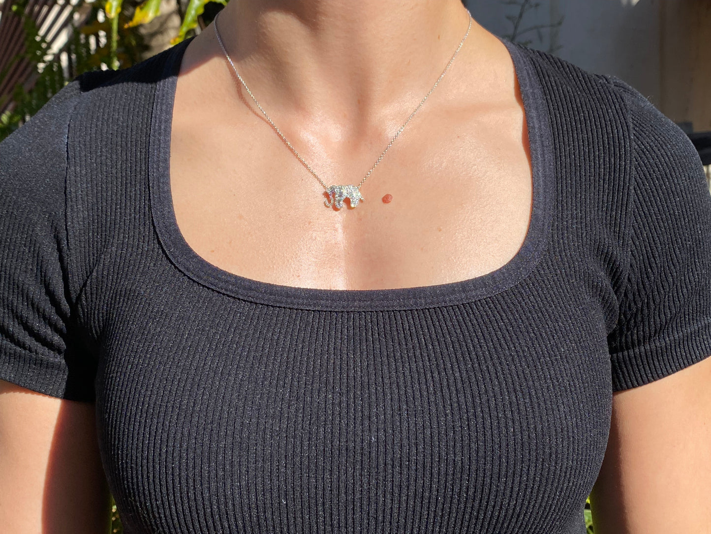 18K gold diamond elephant necklace.