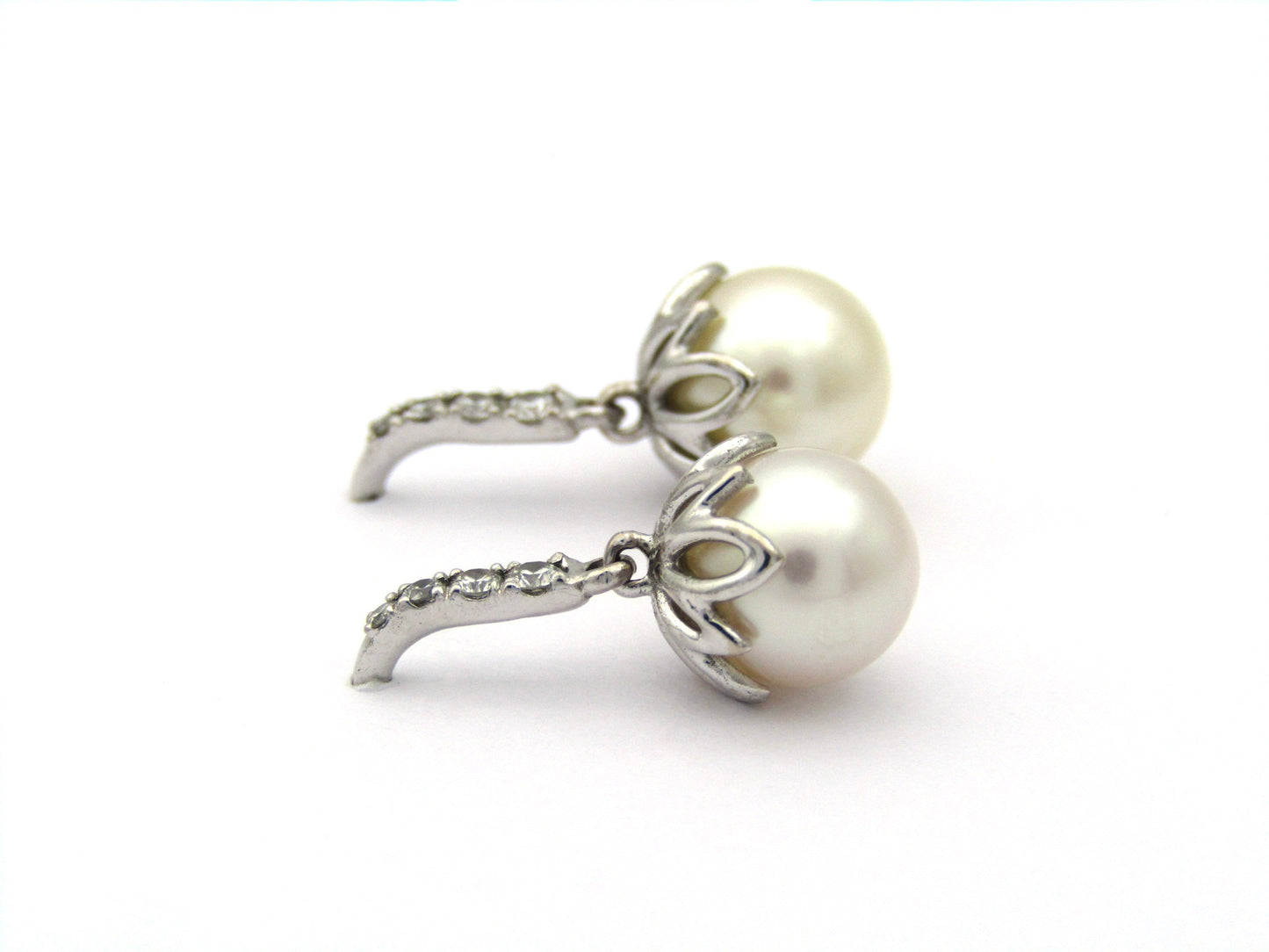 18K gold Protea pearl earrings by Browns.