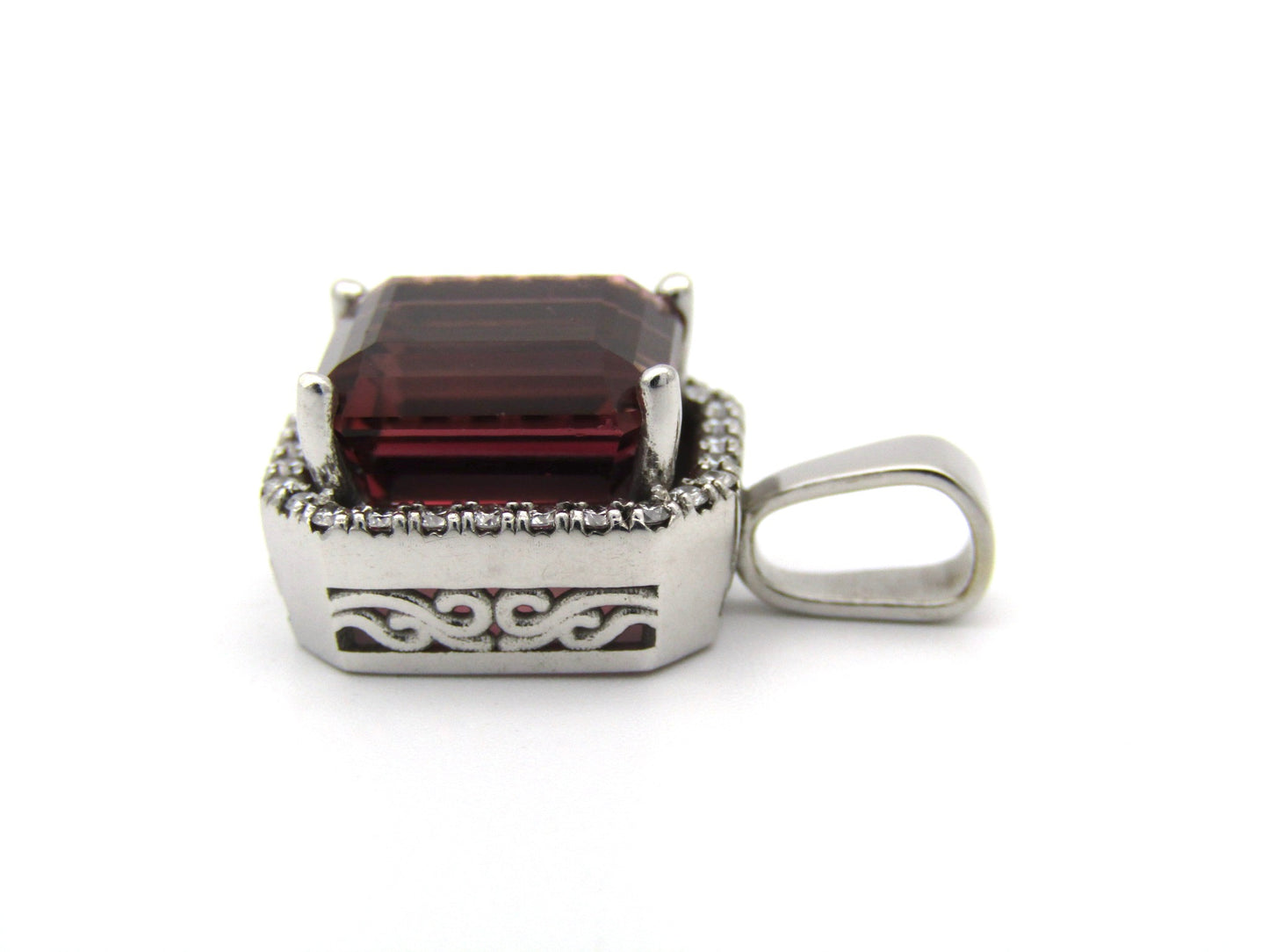 9K gold orange tourmaline and diamond ring.