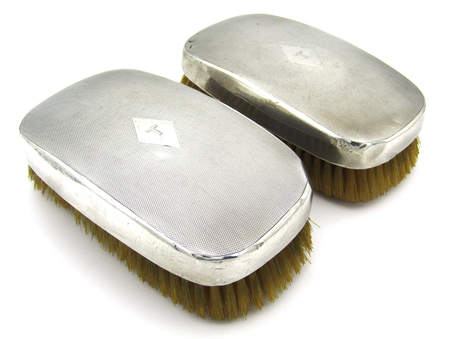 A pair of silver clothes brushes by Charles Packer & Co, London, 1929.