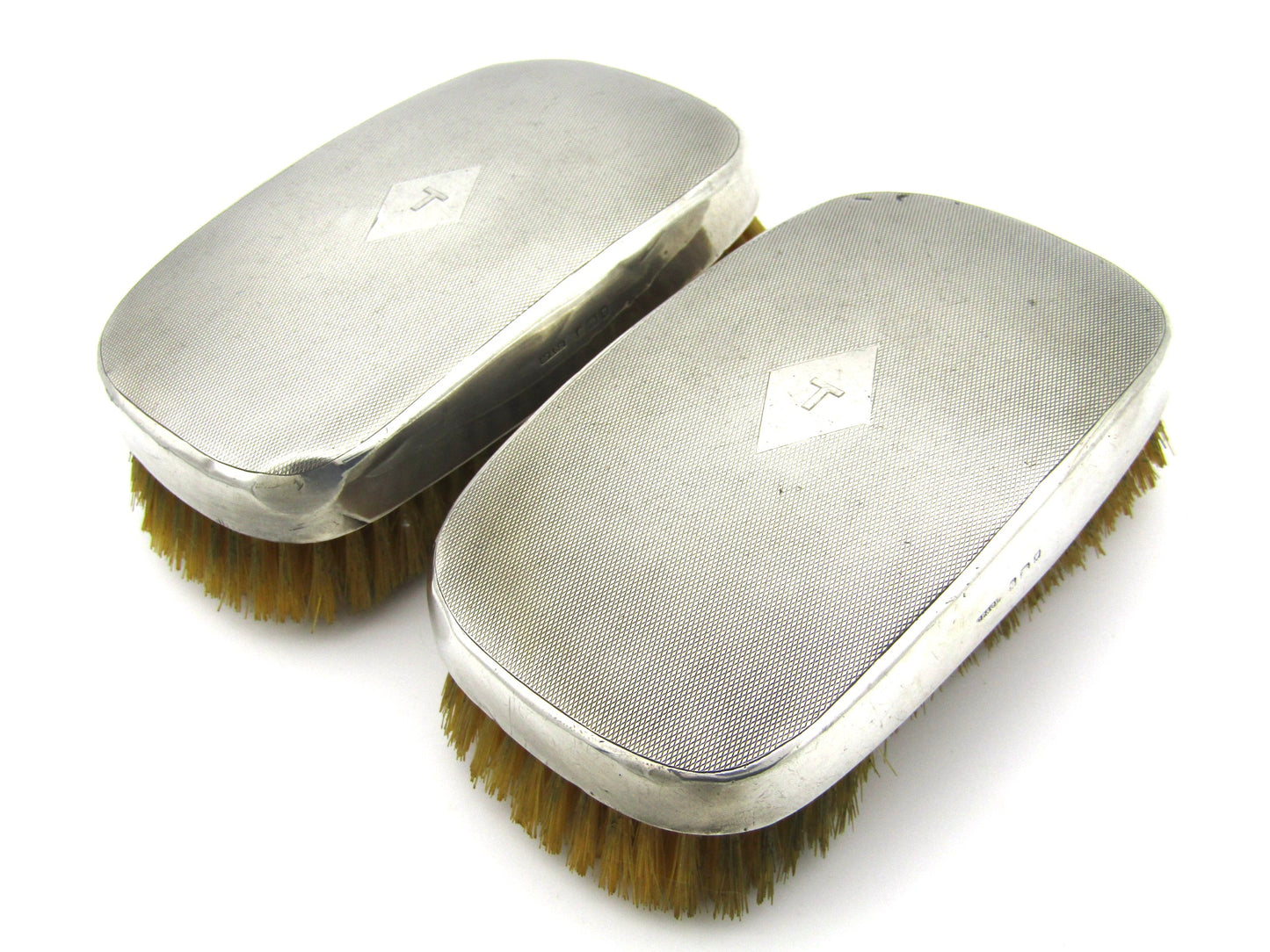 A pair of silver clothes brushes by Charles Packer & Co, London, 1929.