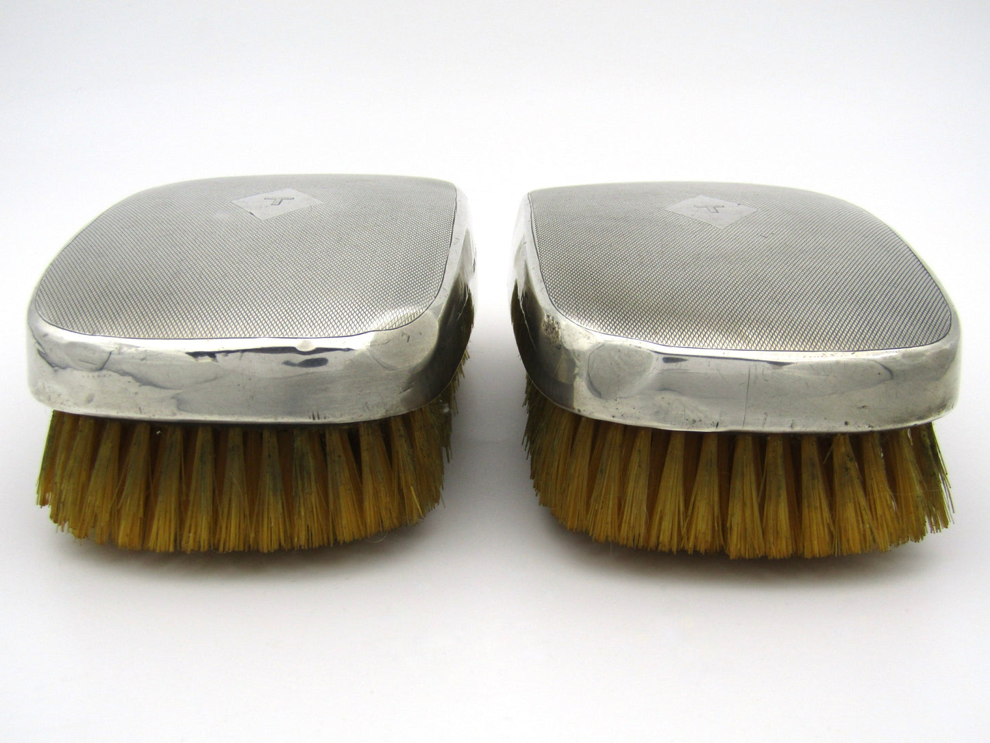 A pair of silver clothes brushes by Charles Packer & Co, London, 1929.