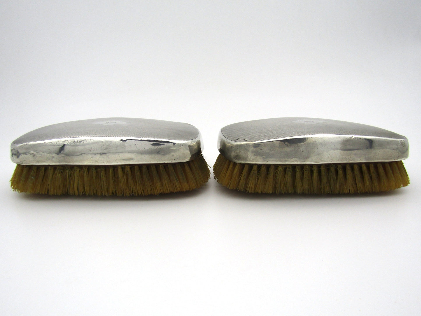A pair of silver clothes brushes by Charles Packer & Co, London, 1929.