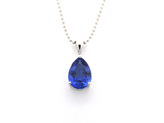 18K gold tanzanite pendant with 18K gold chain.