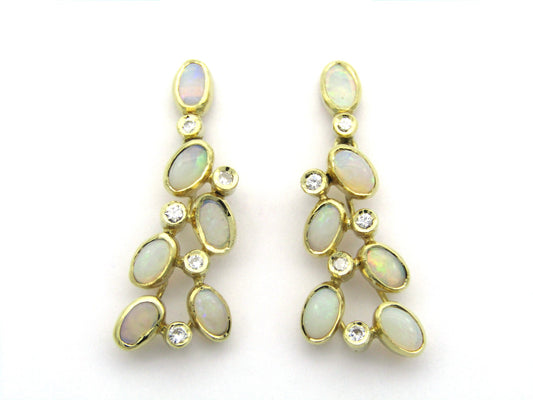 14K gold opal and diamond drop earrings.