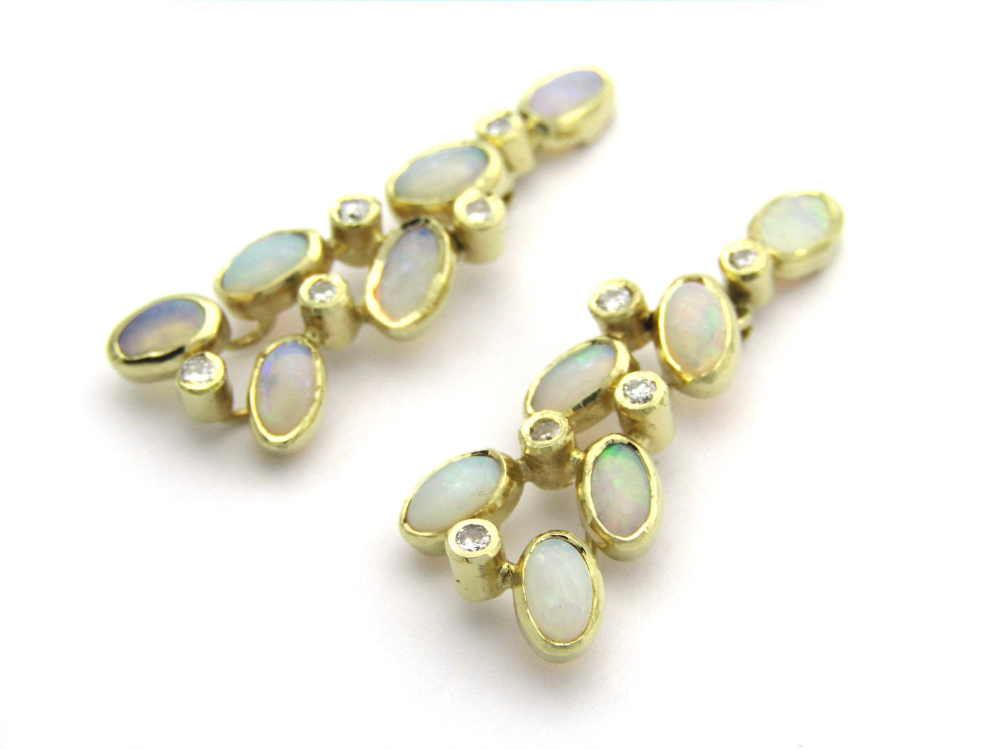 14K gold opal and diamond drop earrings.