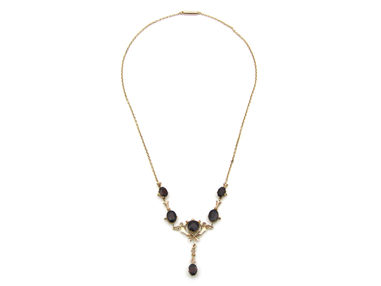 9K gold Edwardian garnet necklace, circa 1910.