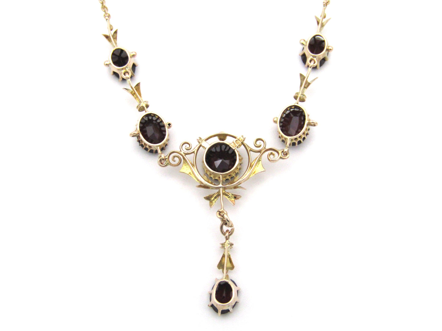 9K gold Edwardian garnet necklace, circa 1910.