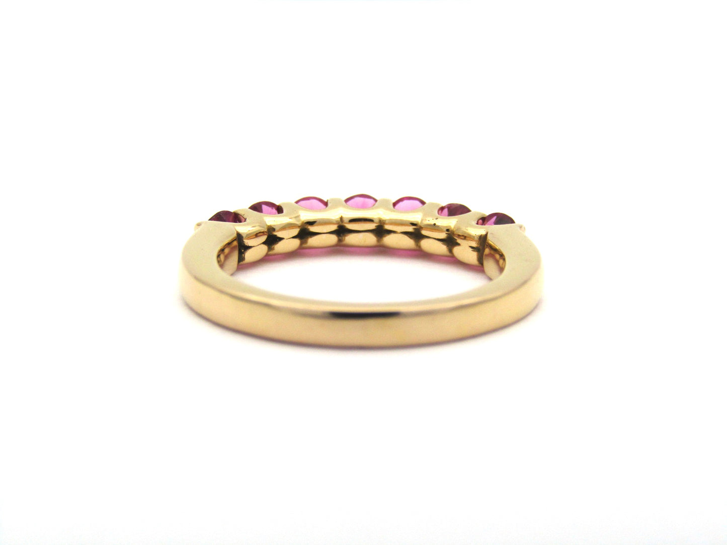 18K gold pink tourmaline half eternity ring.