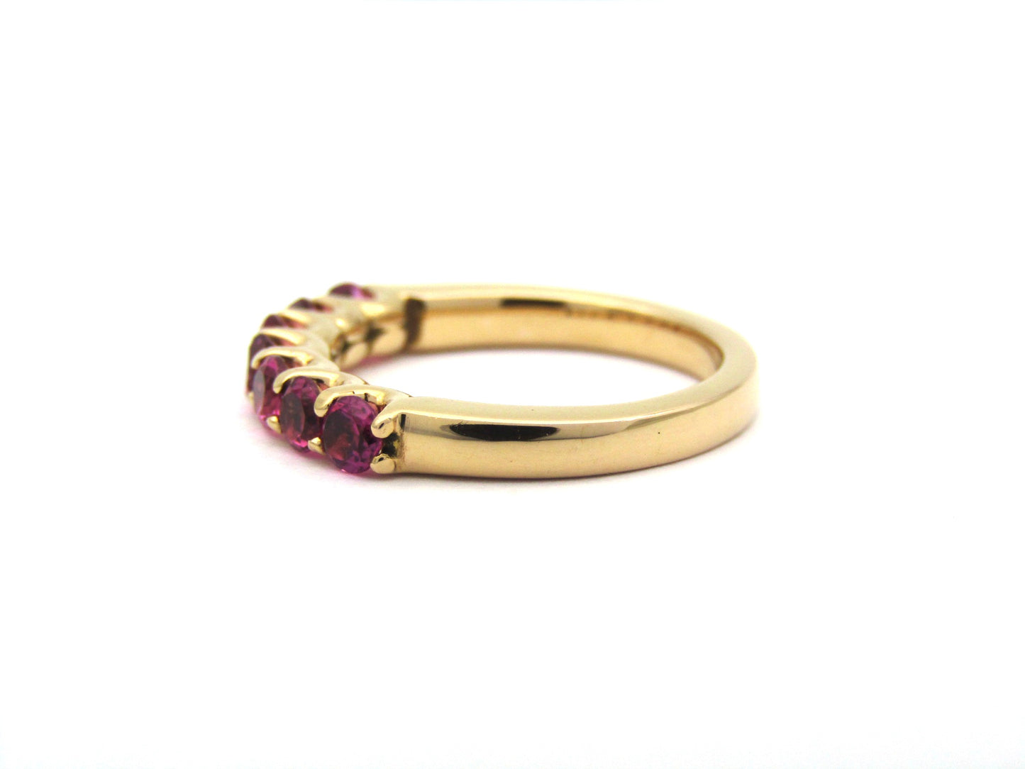 18K gold pink tourmaline half eternity ring.