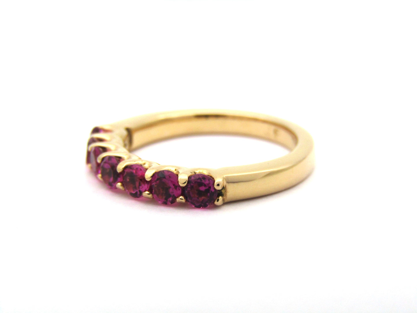 18K gold pink tourmaline half eternity ring.