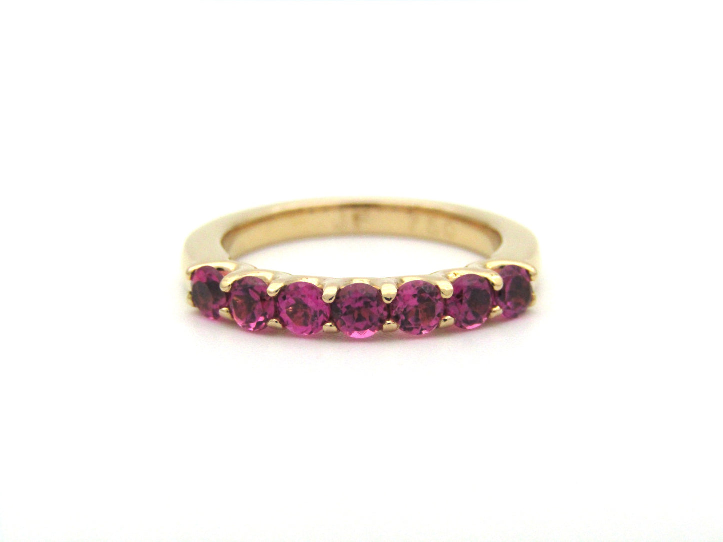 18K gold pink tourmaline half eternity ring.