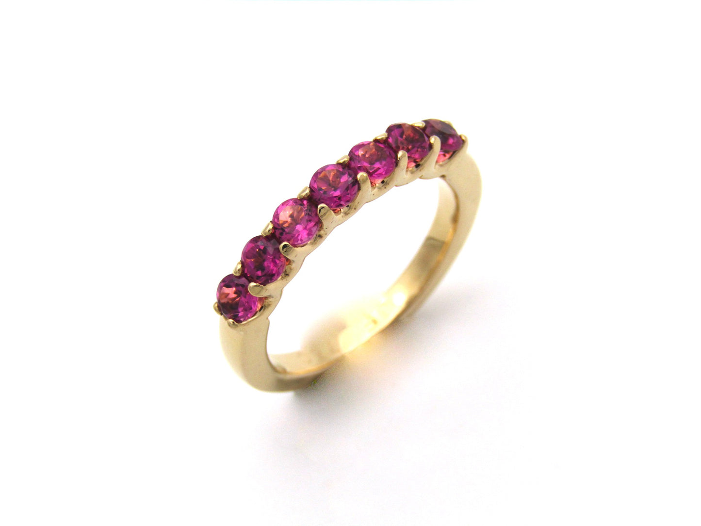 18K gold pink tourmaline half eternity ring.