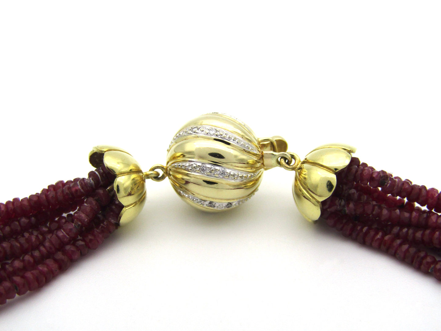 14K gold diamond and 7-strand ruby necklace.