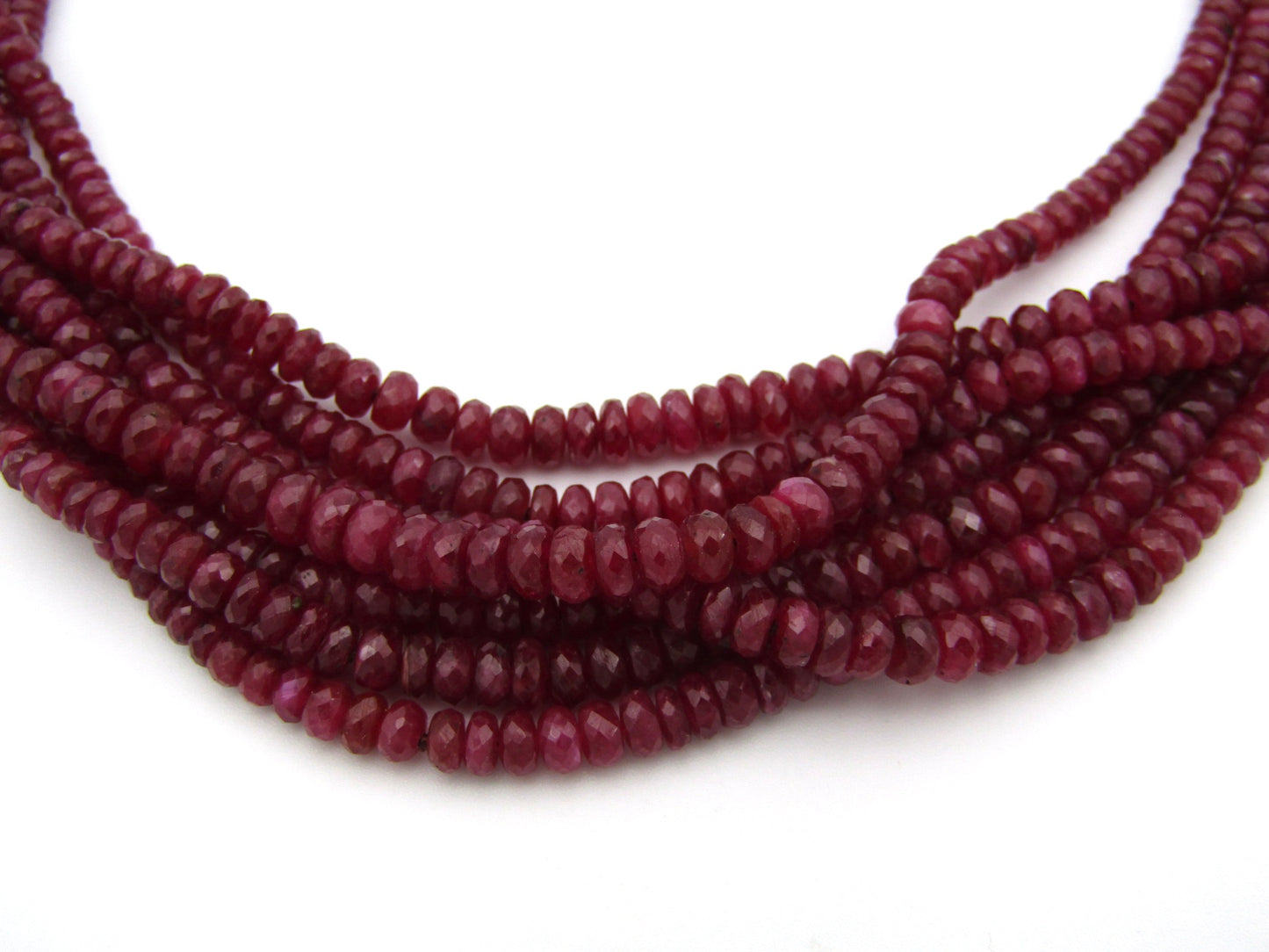 14K gold diamond and 7-strand ruby necklace.