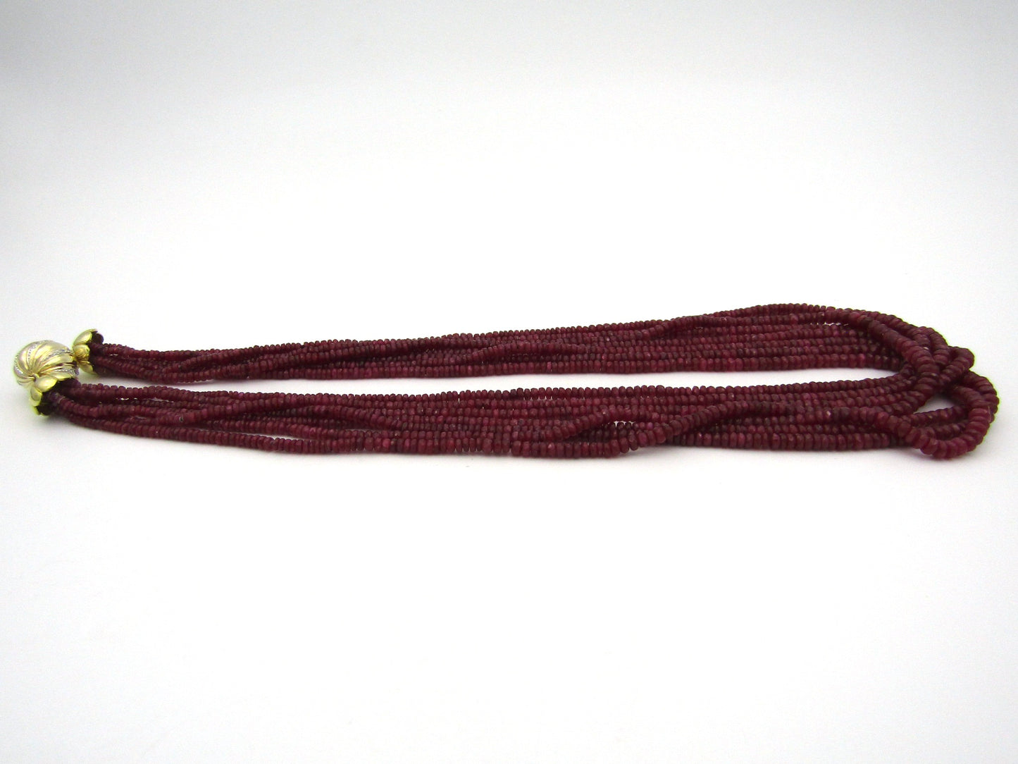 14K gold diamond and 7-strand ruby necklace.