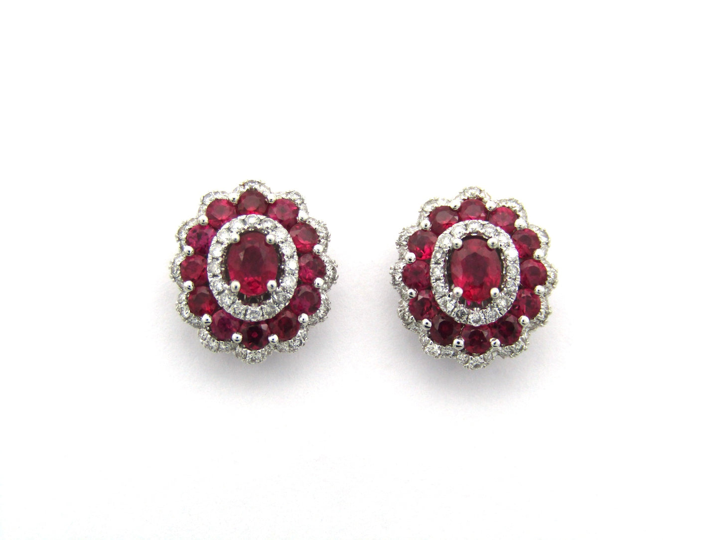 18K gold ruby and diamond earrings.