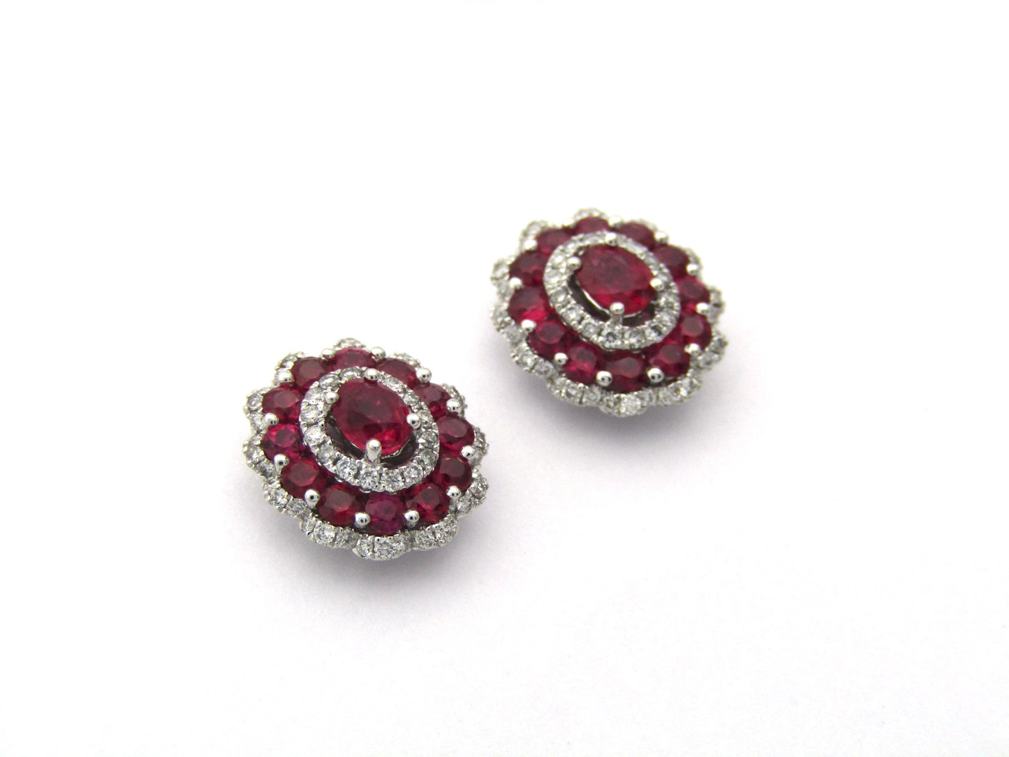 18K gold ruby and diamond earrings.