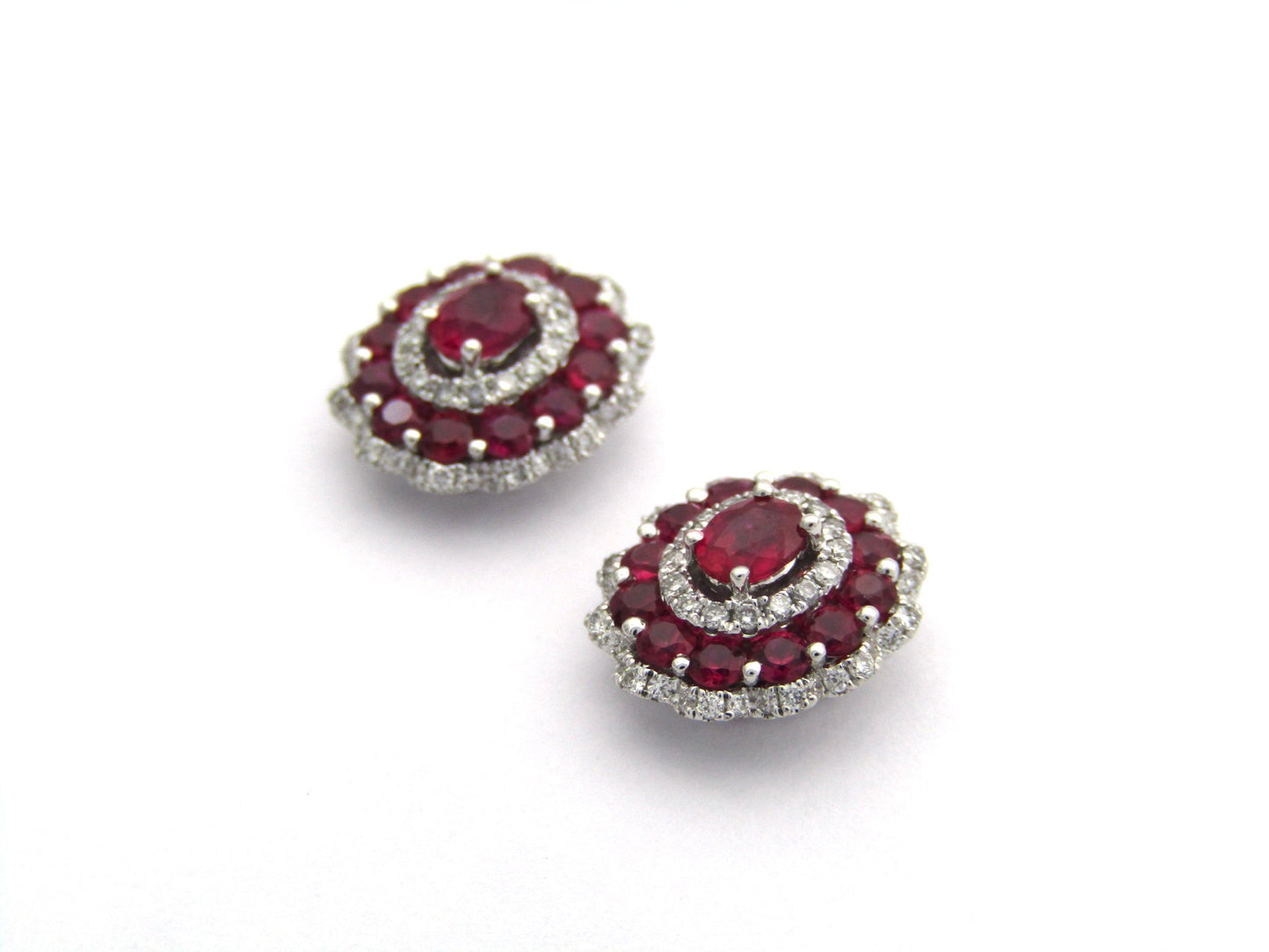 18K gold ruby and diamond earrings.