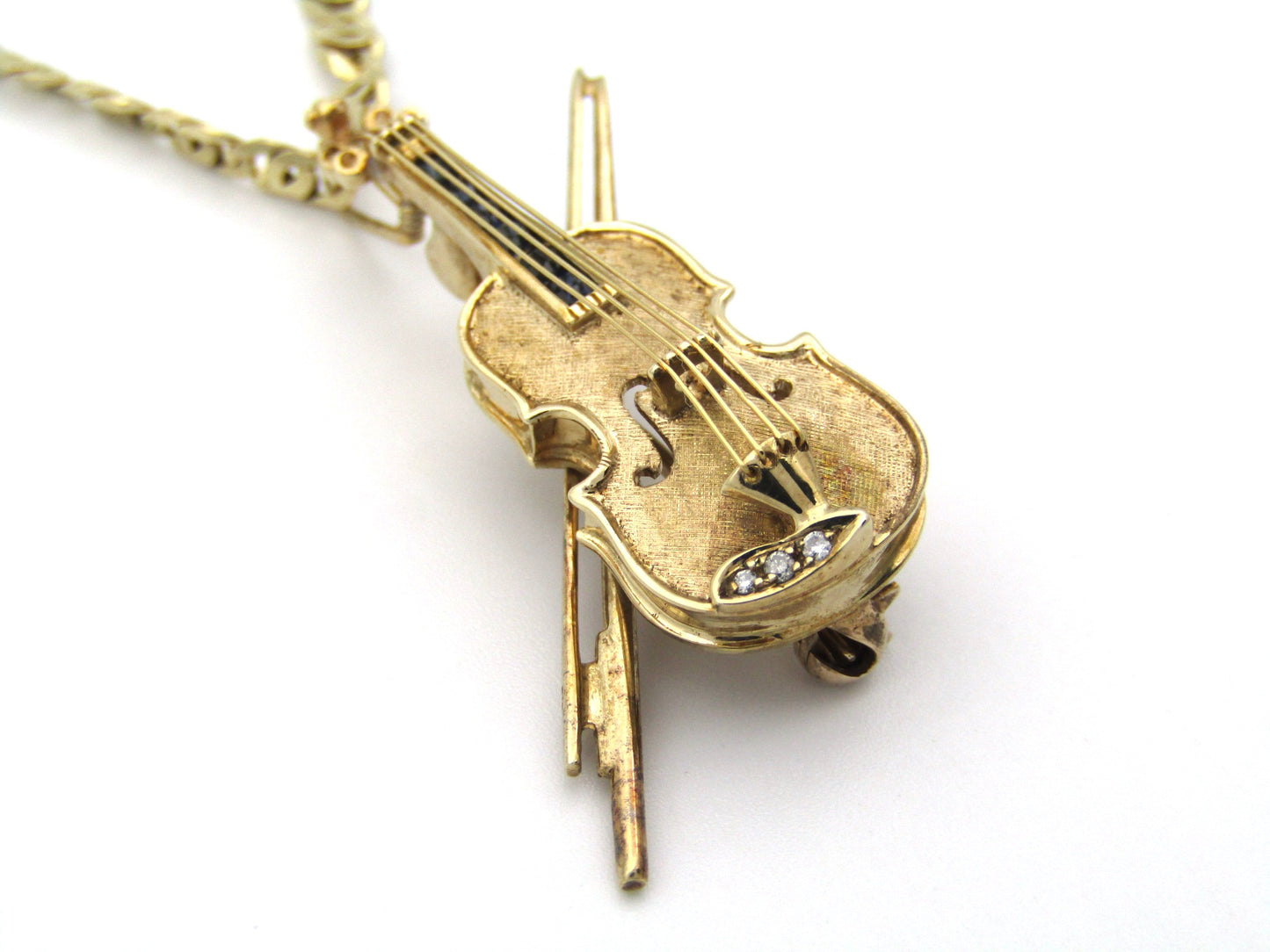9K gold diamond and sapphire violin brooch/ pendant, Birmingham, 1991.