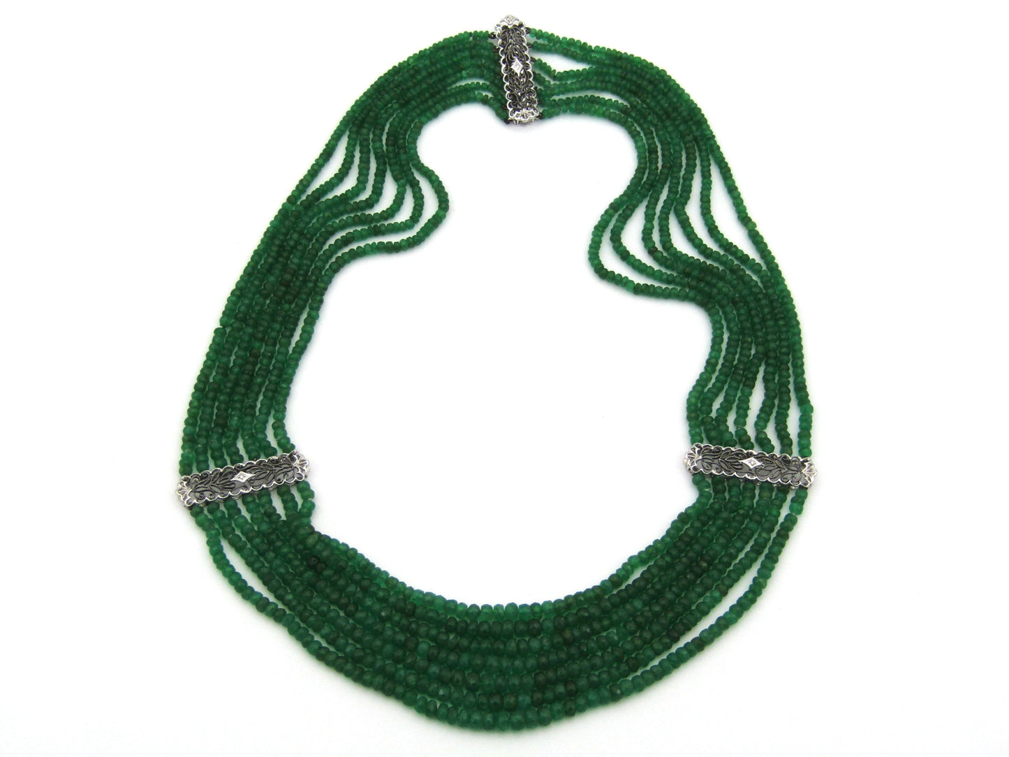 14K gold diamond and 7 strand emerald necklace.