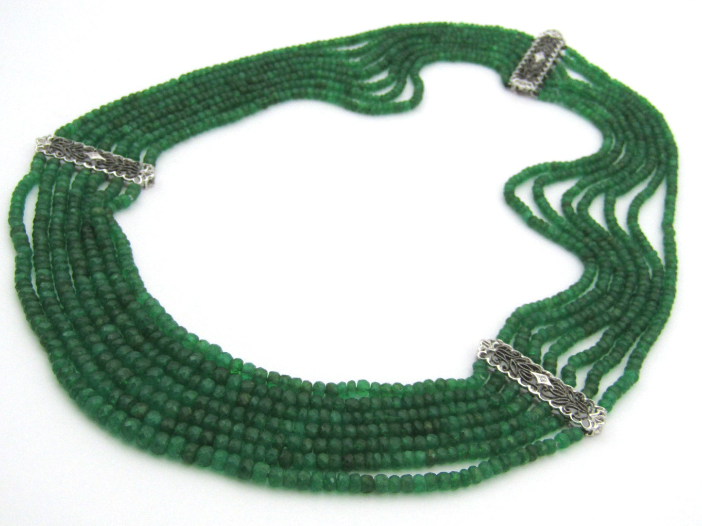 14K gold diamond and 7 strand emerald necklace.