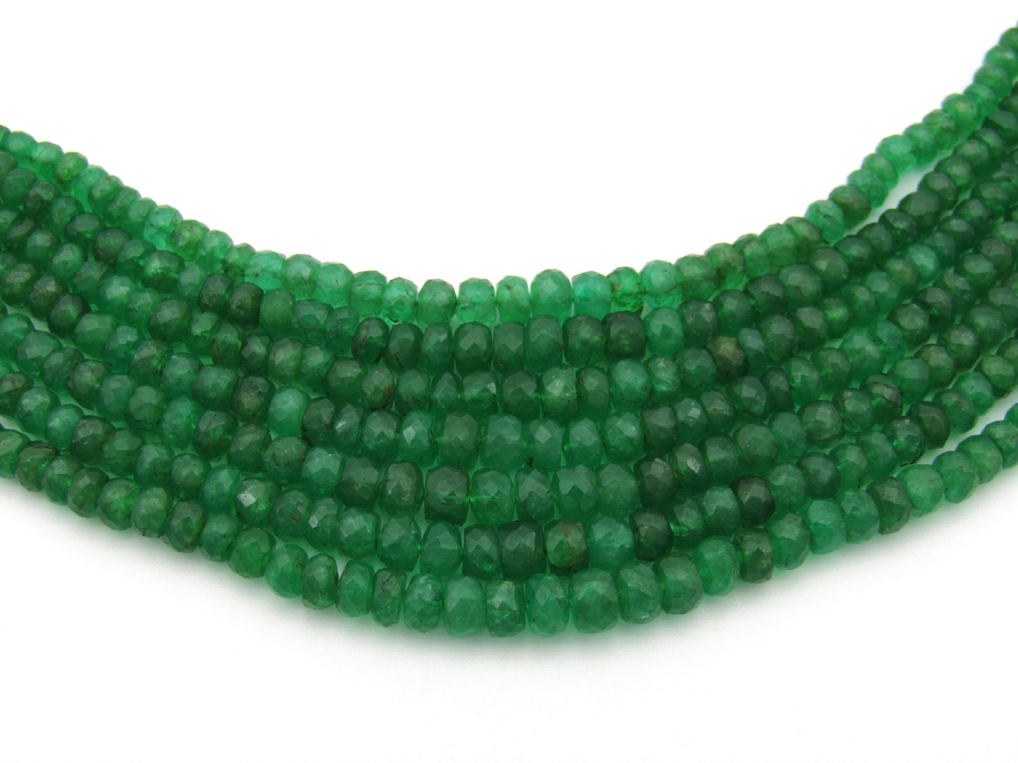 14K gold diamond and 7 strand emerald necklace.