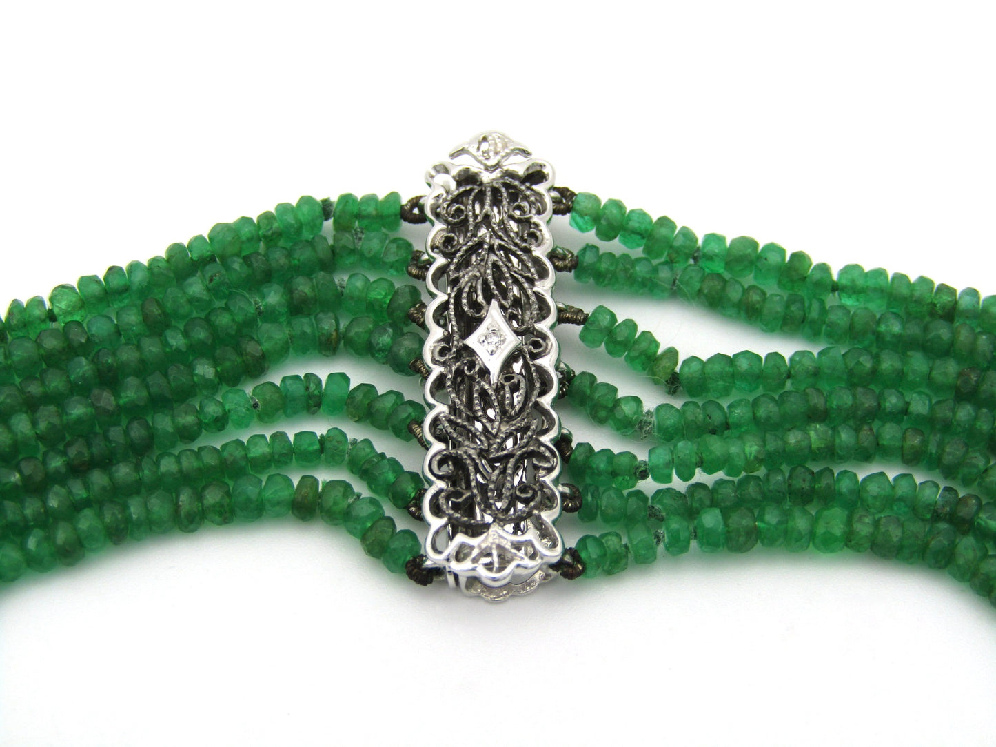 14K gold diamond and 7 strand emerald necklace.