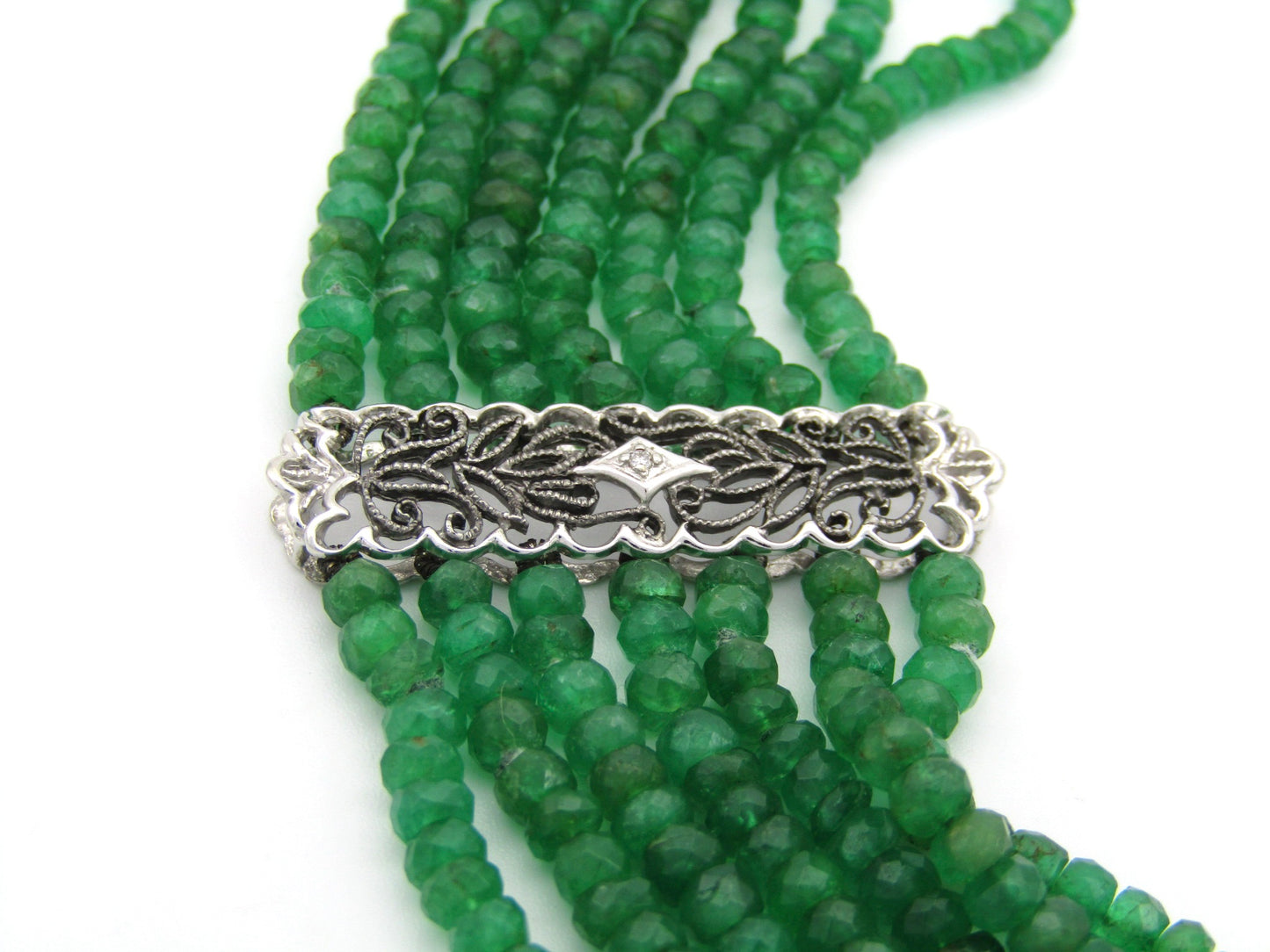 14K gold diamond and 7 strand emerald necklace.