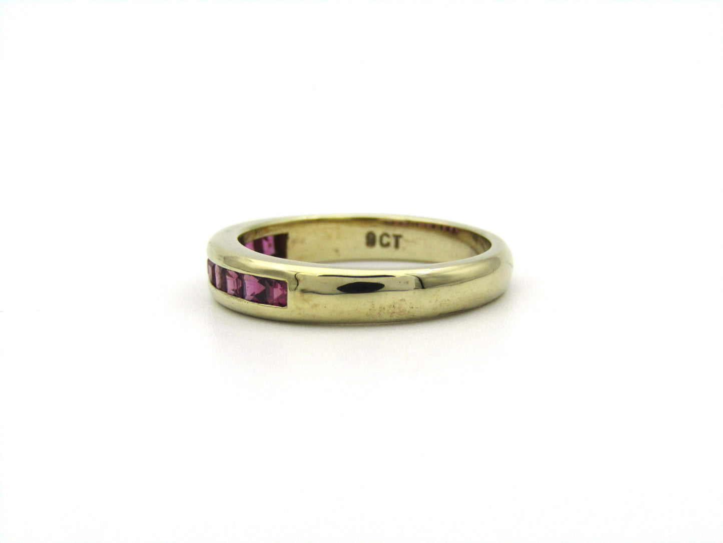 9K gold rhodolite garnet half eternity ring.