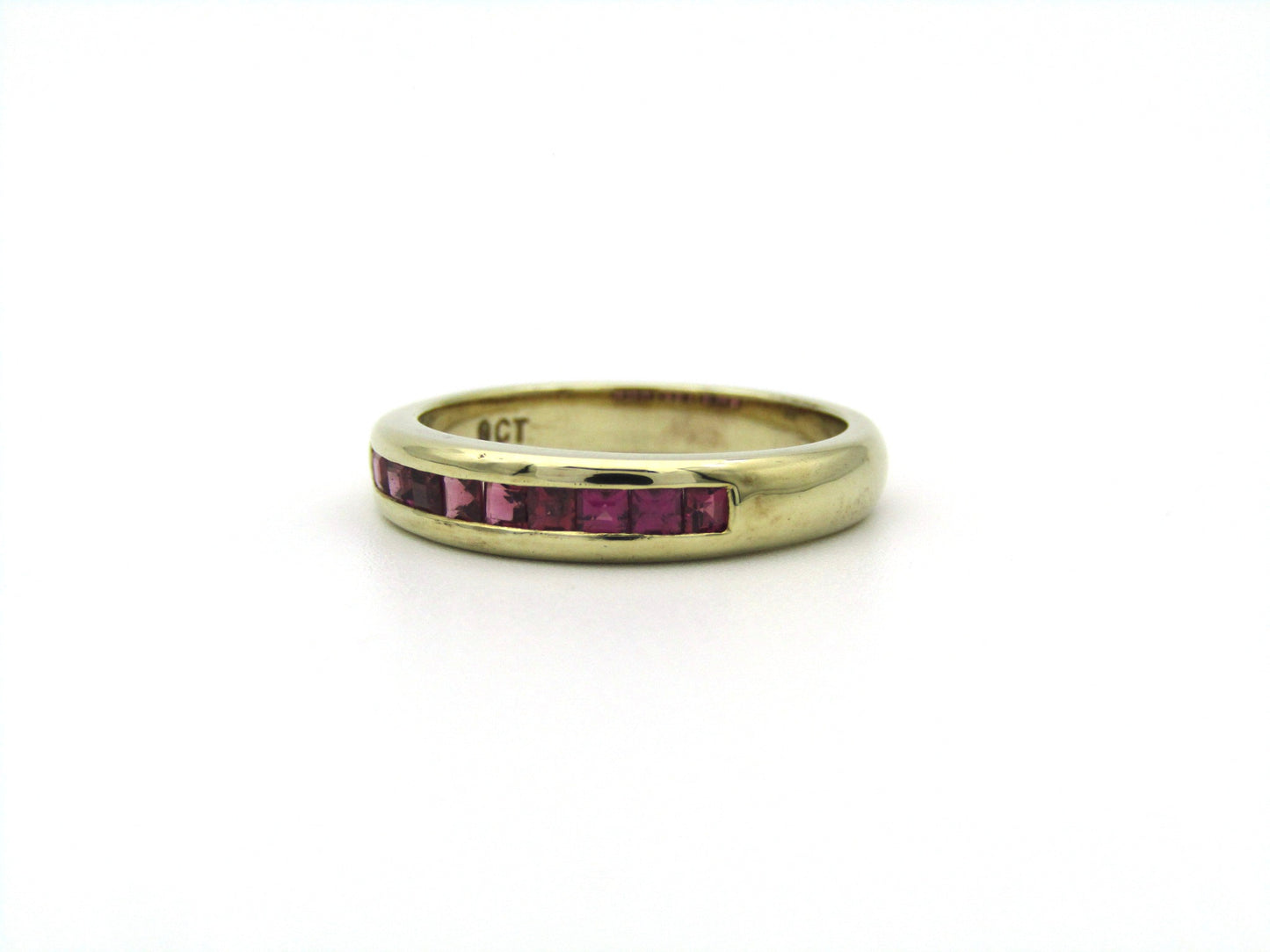 9K gold rhodolite garnet half eternity ring.