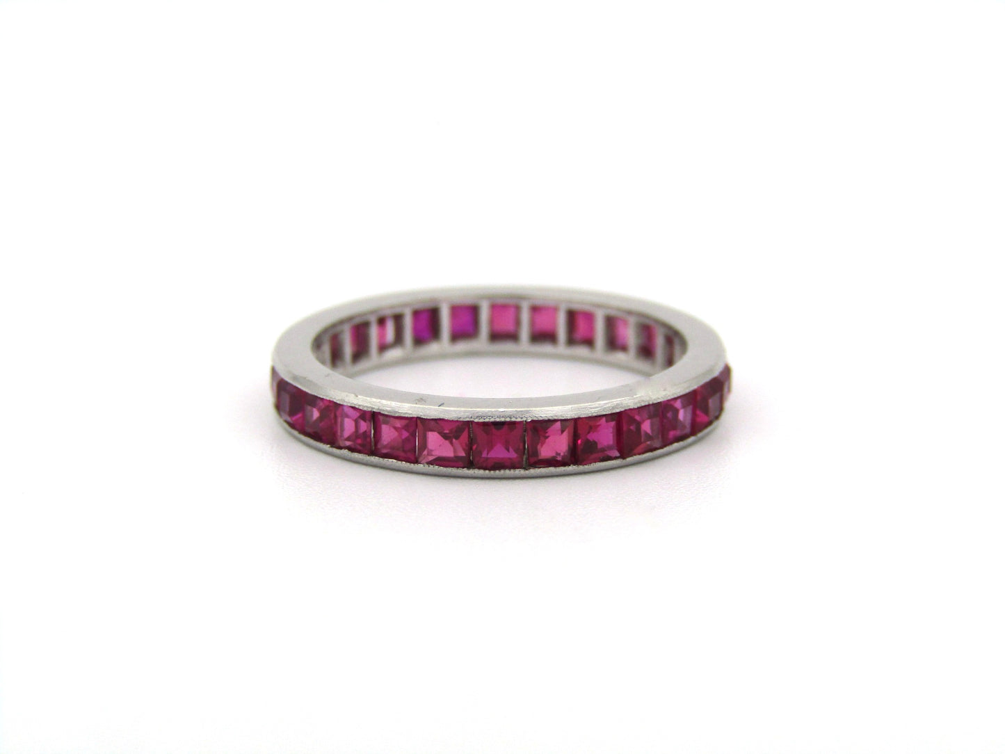 Platinum synthetic ruby eternity ring, circa 1990's.