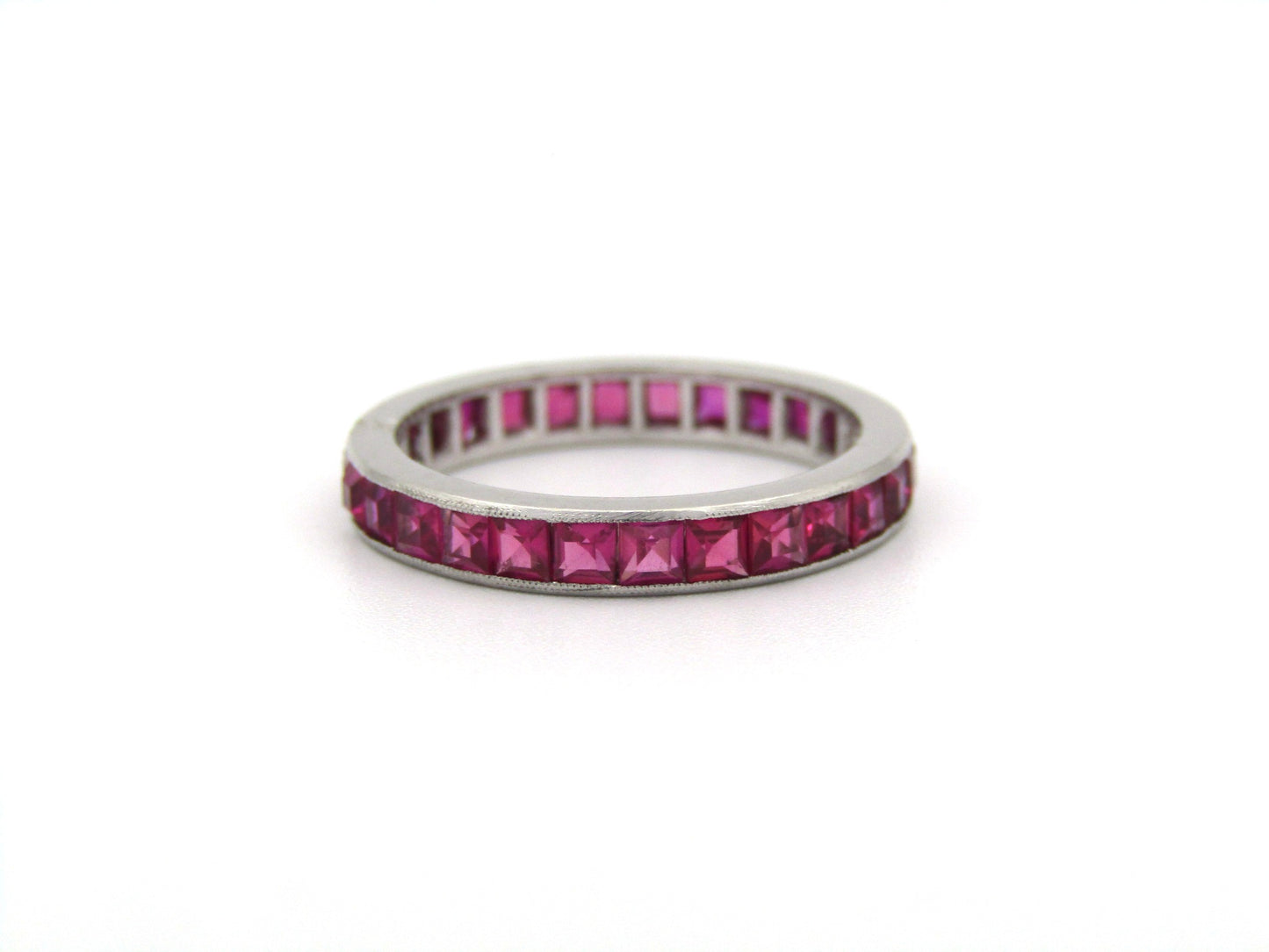 Platinum synthetic ruby eternity ring, circa 1990's.
